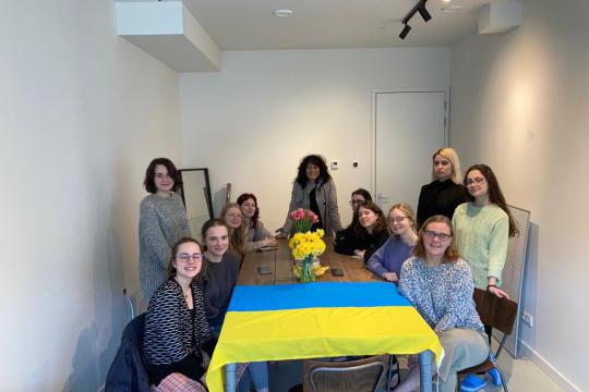 The ten Ukrainian students around a table